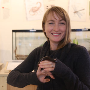 Photo of Lead Animal Keeper, Brenna Shea, holding Milton our Giant African Millipede.
